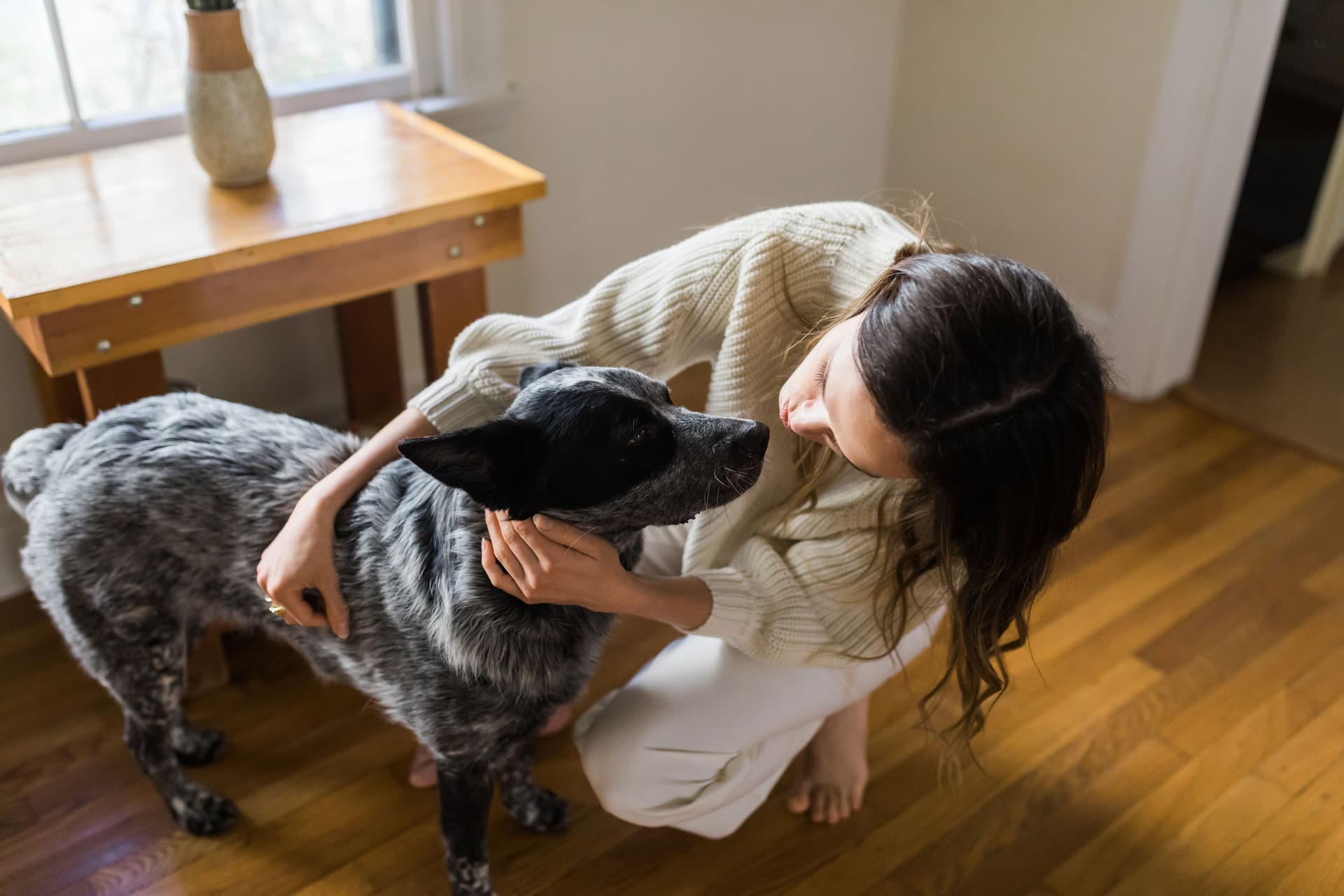 Adriene Mishler plays with her dog