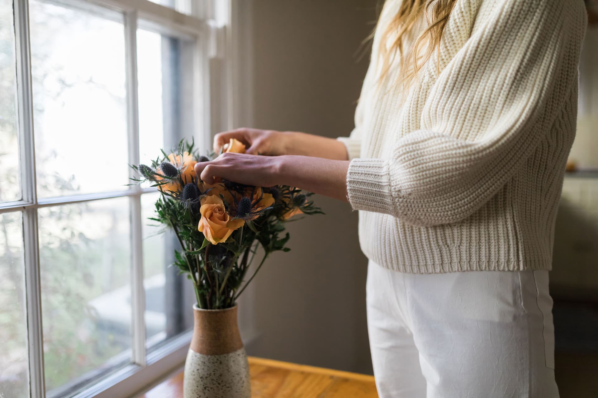 Adriene Mishler tends to flowers