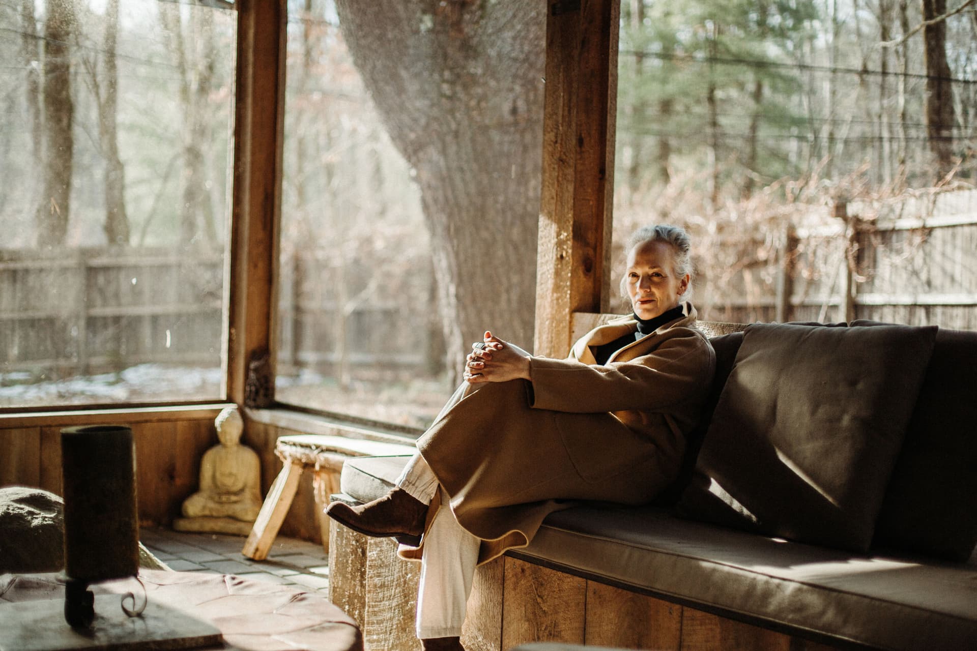 Laura Silverman sits in a dimly lit cabin
