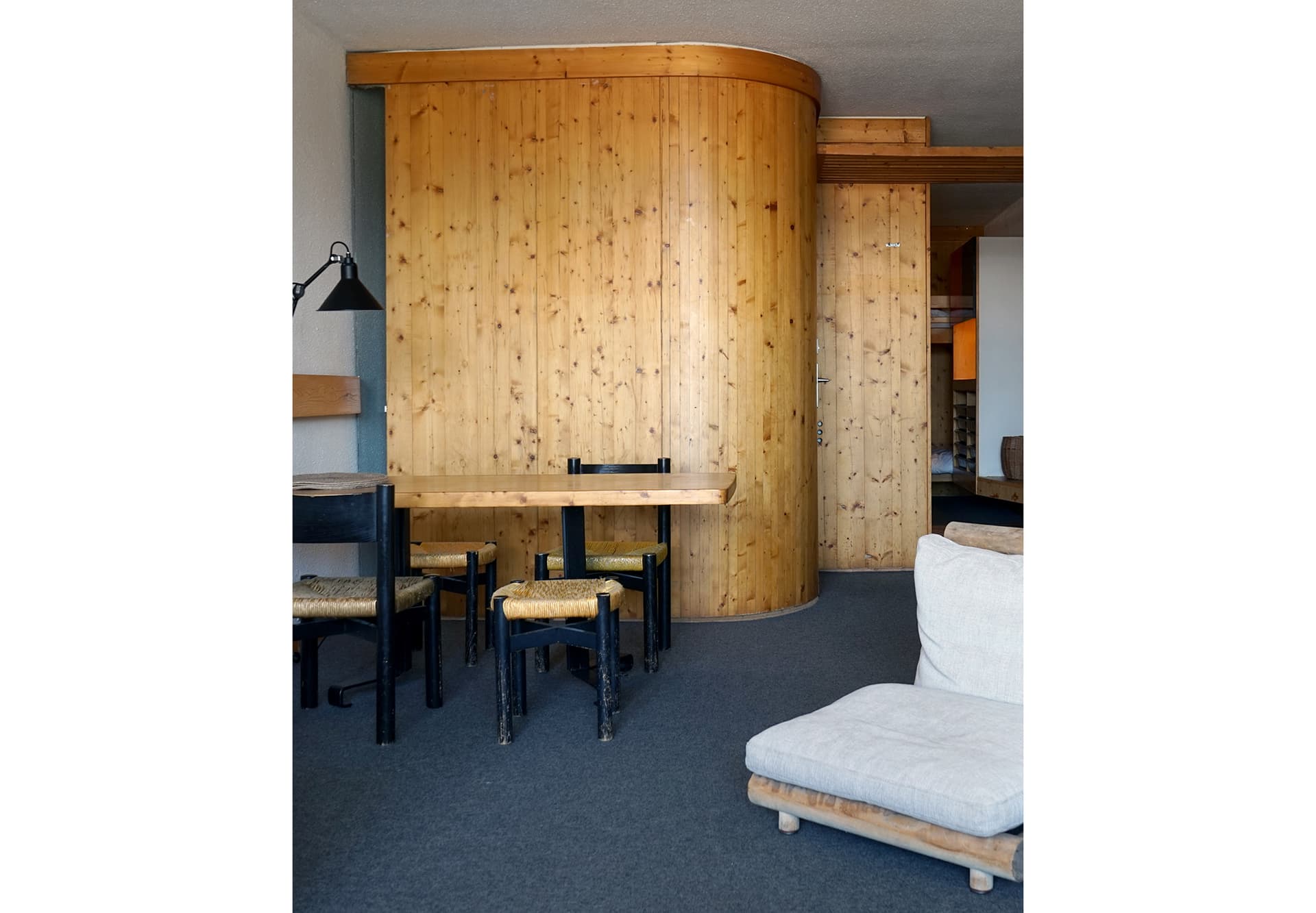 A photo of an empty room with wood paneling
